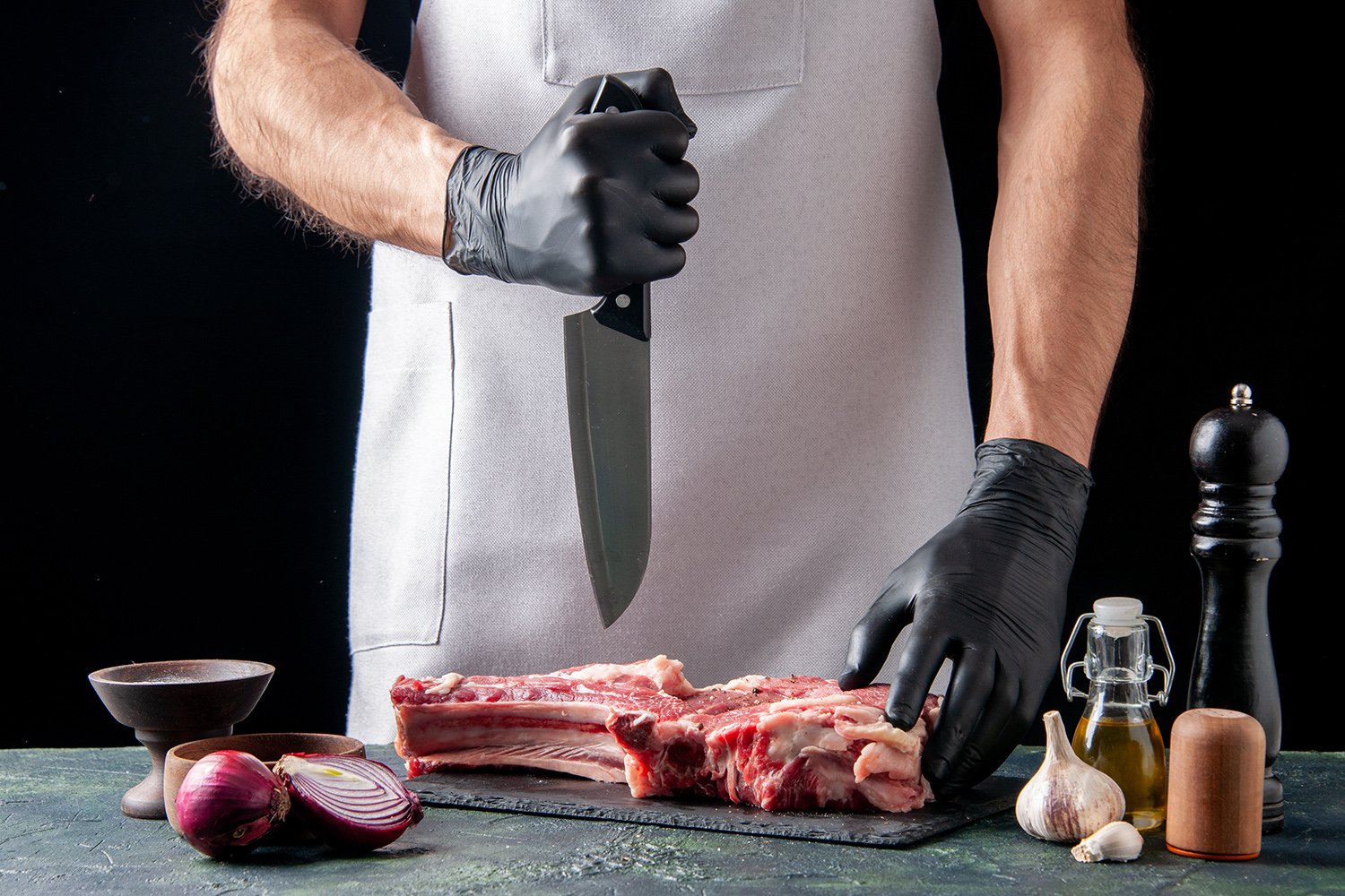 front view male butcher cutting meat on dark background food ani